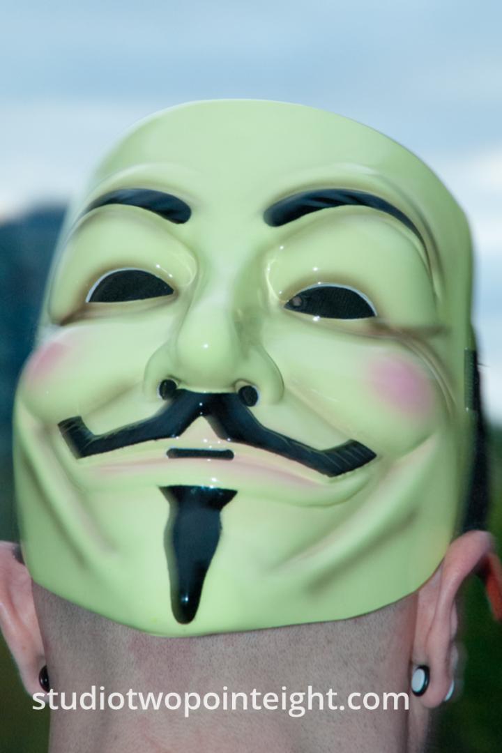 2015 Seattle May Day Protest And Mayhem, Protester With Guy Fawkes Mask On The Back Of His Head
