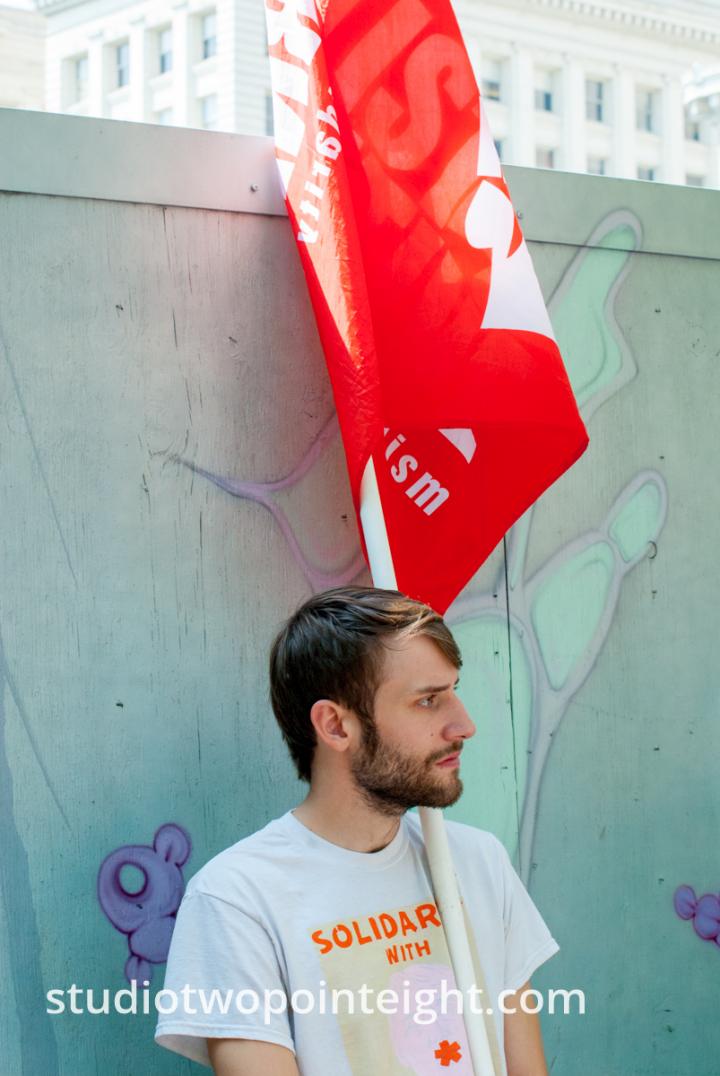 Seattle, August 18, 2018, Liberty or Death Rally Counter Protester Carried a Resist and Solidarity Flag