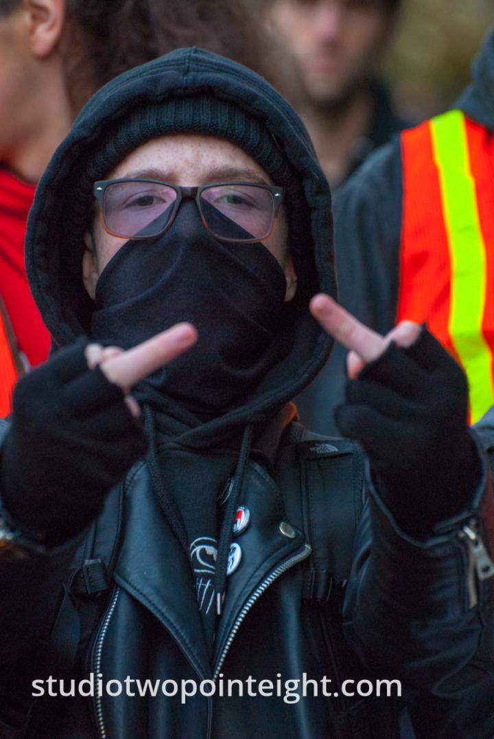 Seattle, Liberty or Death 2 Rally, December 1, 2018, A Masked Black Bloc Counter Protester Flipped The Bird