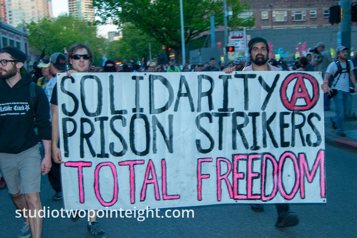 2014 Seattle May Day Protest, Anarchist Protesters Carried A Solidarity With Prison Strikers Banner