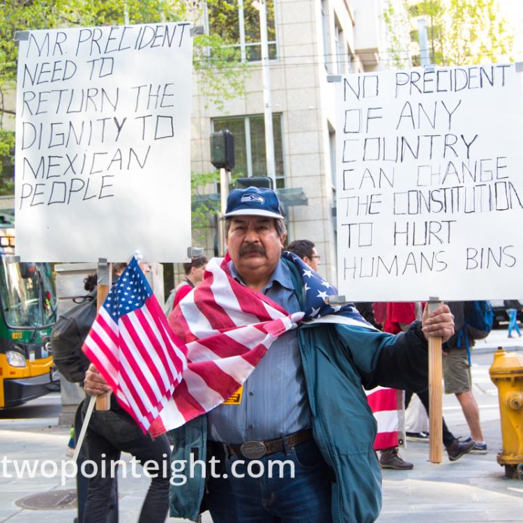 Seattle May 1, 2019 May Day Immigration Rally A Man Displayed Posters About Mexican Immigrants
