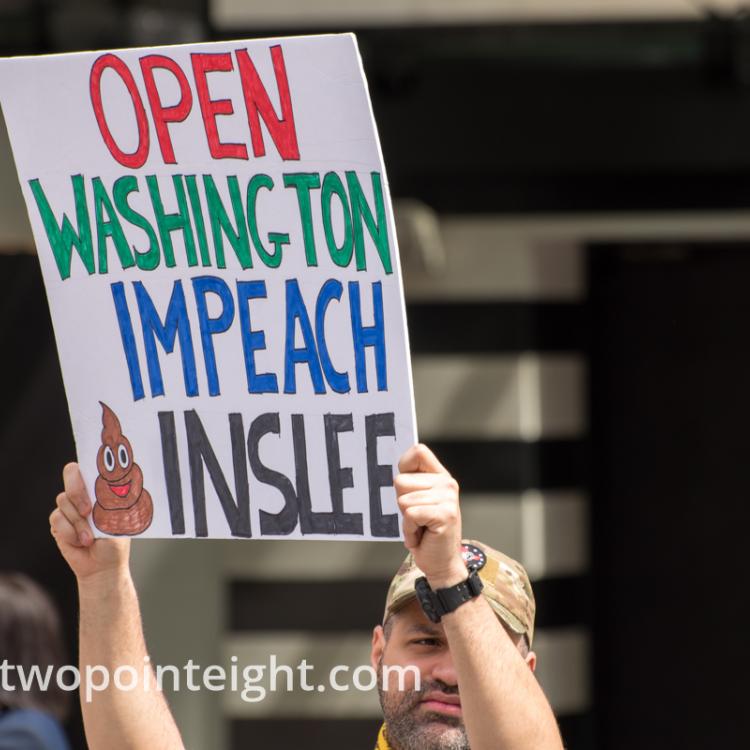 Studio 2.8, May 1, 2020, Seattle May Day End Coronavirus Lockdown Protest, An Attendee Displayed A Large Poster With The Phrase Open Washington Impeach Inslee On It