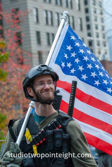 Seattle, Liberty or Death 2 Rally, December 1, 2018, Washington Three Percent Member Carrying A Stars and Stripes American Flag