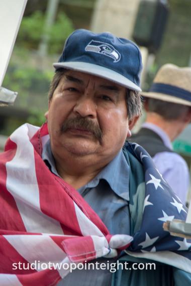Seattle May 1, 2019 May Day Immigration Rally Attendee Wrapped in an American Flag