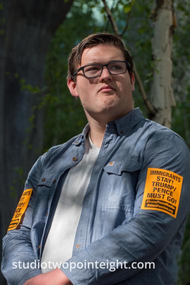 Seattle May 1, 2019 May Day Immigration Rally Man Wore Revolutionary Communist Party Stickers