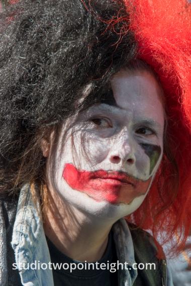 Seattle May 1, 2019 May Day Immigration Rally Woman With White Painted Face and Red and Black Wig