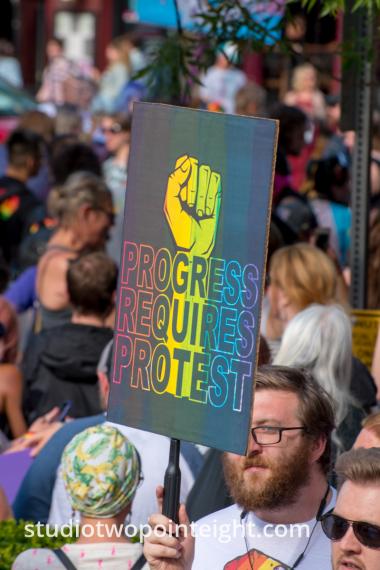 Seattle Trans Pride 2019, Man With Poster Progress Requires Protest